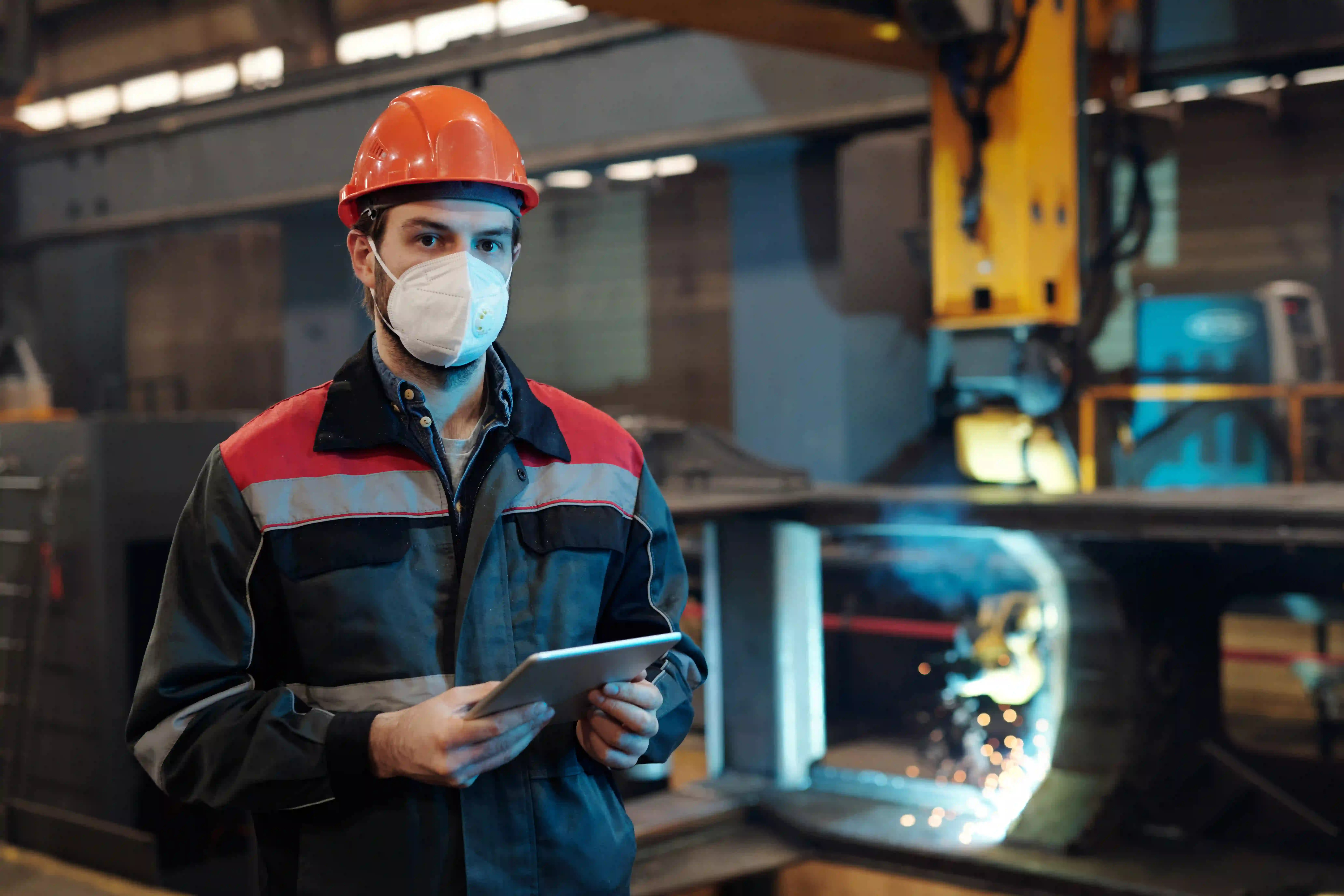 Factory engineer practicing workplace safety on employee app