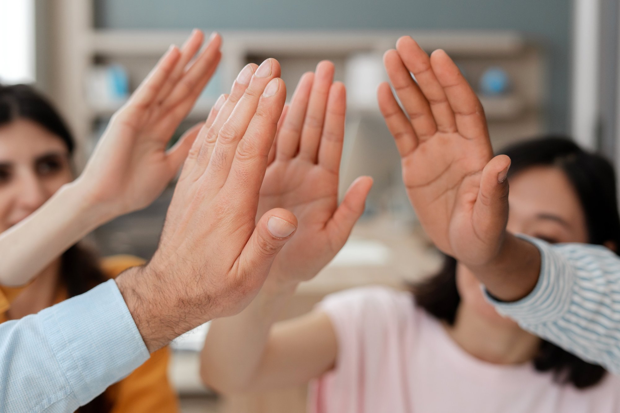 happy-business-team-giving-high-five-celebrating-s-2025-02-20-10-15-56-utc